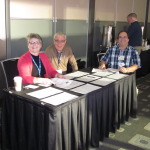 Image of the registration table with 3 registrars