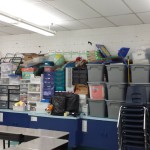 Image of classroom supplies stored in rubber containers stacked on top of one another