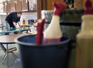 Man cleaning a desk