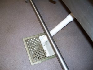 Image a new floor drain installed in a floor