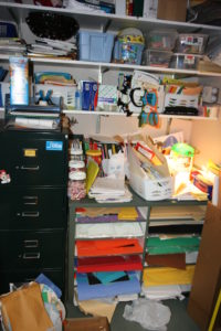 This area is in need of some decluttering. Start small, use storage containers to sort and place keep items in them. 
