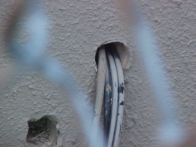 conduit running through a hole to large